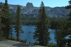 Crystal Crag stands guard over boaters, enjoying a few last minutes before the thunderstorm on Lake Mary.