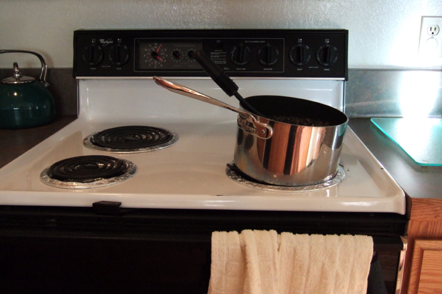 Cooking morning oatmeal on the tilted burner.