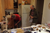 Frank and David prepare dinner.
