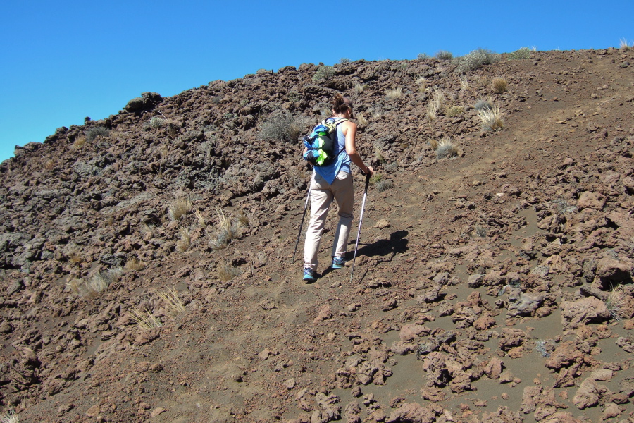 Laura presses up a typical steep, loose section of trail on the lower slope.