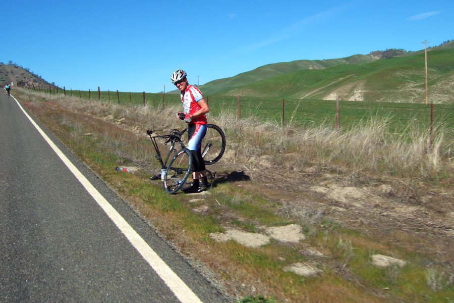 Jay Kilby enjoys a roadside flat-repair session.