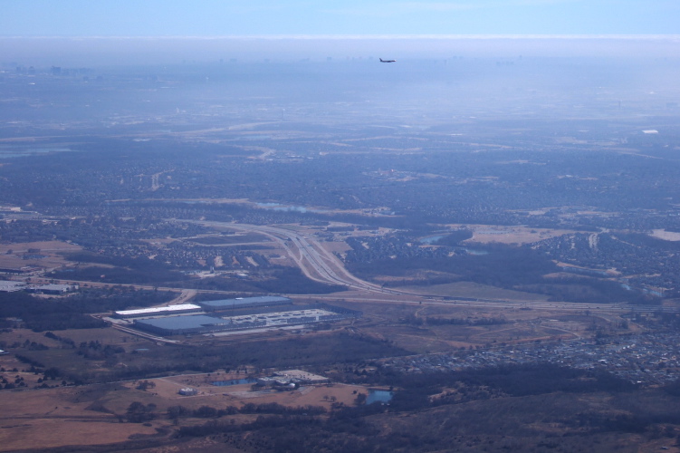 Plane landing on parallel runway.