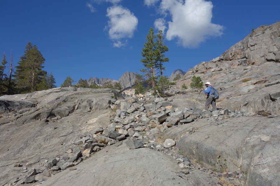 The trail climbs up a granite wall.