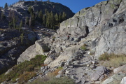 Frank ascends the stairs past the Shadow Creek cascade.
