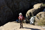Frank ventures down the highly-sloped rock to get close to the creek.