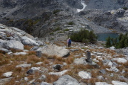 Frank heads down to the Class 3 descent at the southern outlet of Cecile Lake.