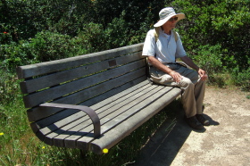David rests on a comfy bench.