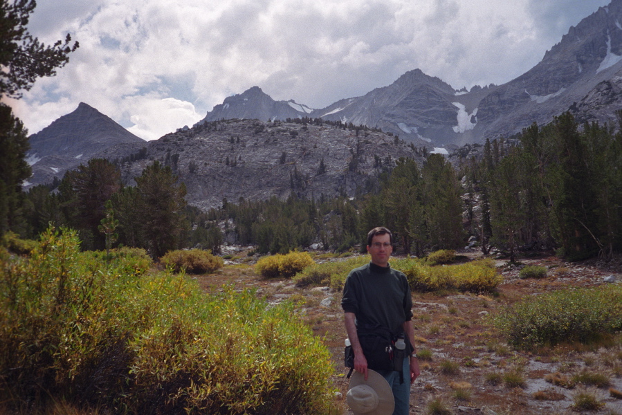 Returning to the trailhead as storm clouds gather over the mountains.