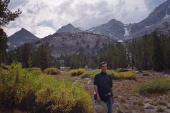 Returning to the trailhead as storm clouds gather over the mountains.