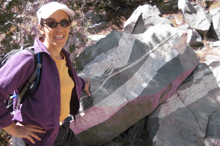 Stella's sweater infected the rock with the purple fungus.