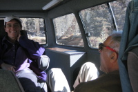 Stella is ready to give orders from the captain's chair, while David tries to get comfortable on the floor.