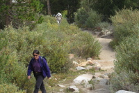 Stella and David trudge up the trail.