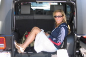 Laura gets in the back of her Jeep.