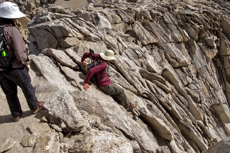 Bill downclimbs the crux of the climb.
