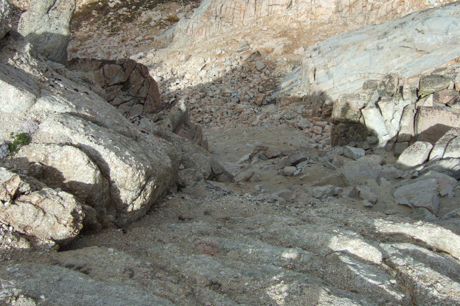 The steep, sandy use trail leads down from here.