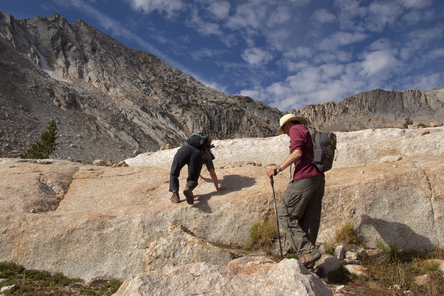 Stella shows off her moves climbing the large rock.  Bill follows.