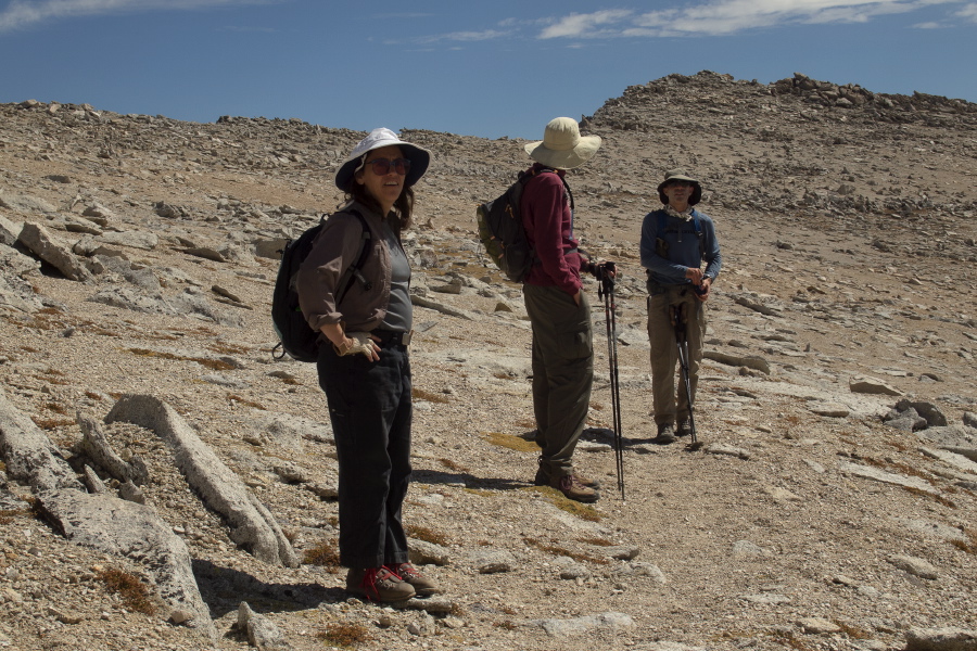 Bill and Charles Povtrovsky (who just descended from the summit) discuss routes while Stella begins to wonder what she got herself into.