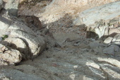 The steep, sandy use trail leads down from here.
