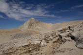 Stella pushes on up the plateau to the summit.