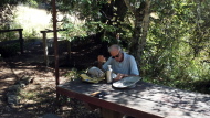 David stops to eat lunch at the convenient picnic table and adjacent hat rack.