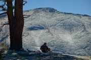 David enjoys lunch on Mount Watkins with a view of Clouds Rest