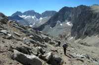 Frank and Stella follow Bill up Mt. Starr.