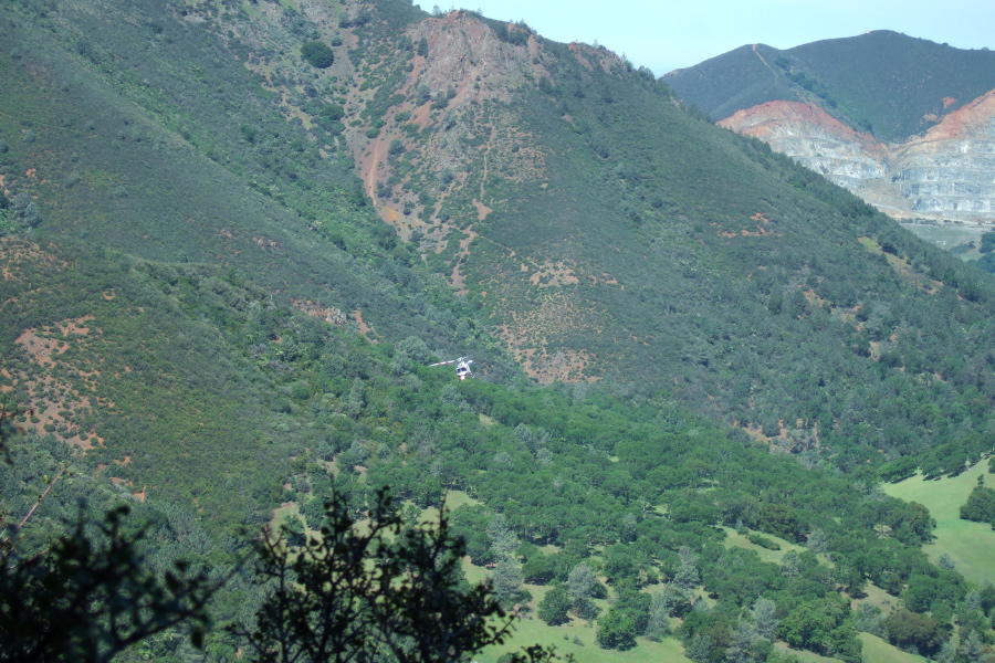 A helicopter hovers over Donner Canyon.