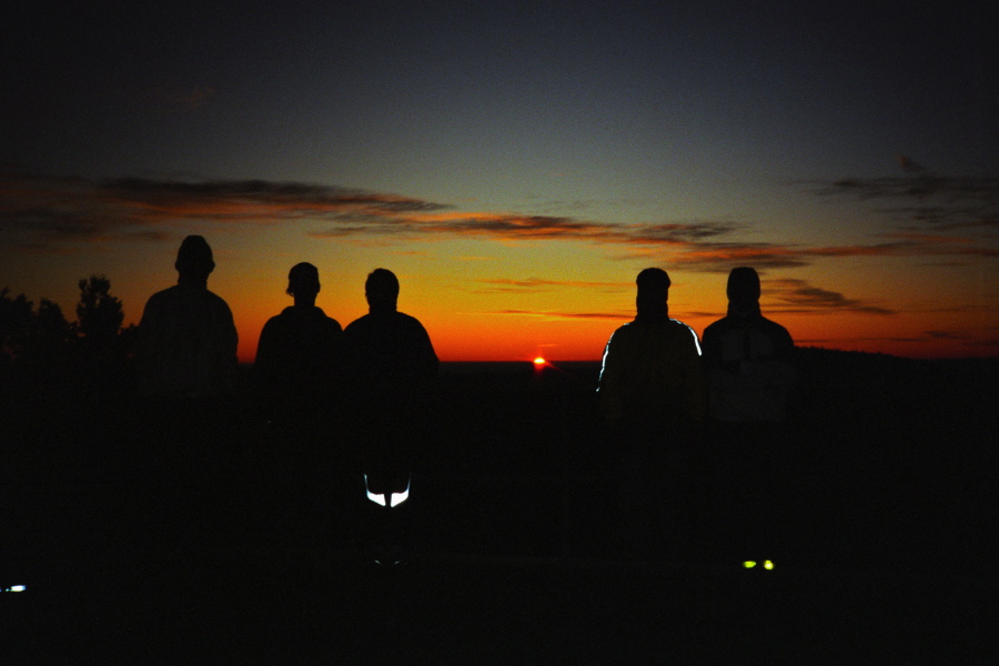 Group photo on the Mt. Hamilton summit as the sun makes its appearance.