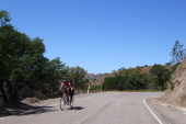 A tandem couple climbs Mines Rd.