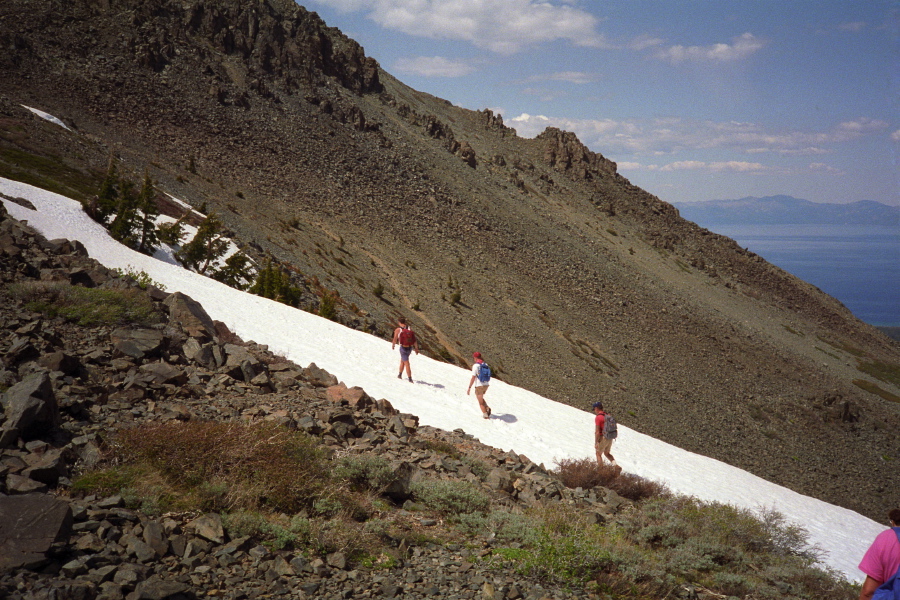 The trail crosses a snow field.