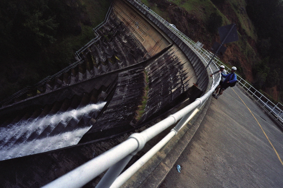 Nahoya and Howard watch water stream from Alpine Dam.