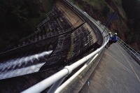 Nahoya and Howard watch water stream from Alpine Dam.
