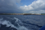 We speed away from Port Allen while clouds enshroud the higher points on the island.