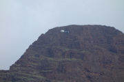 A helicopter tour goes by above.