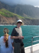Bill stands at the railing next to a wide woman.
