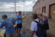 Kay speaks with the captain.