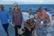 Kay David, and Laura relax on the return trip.