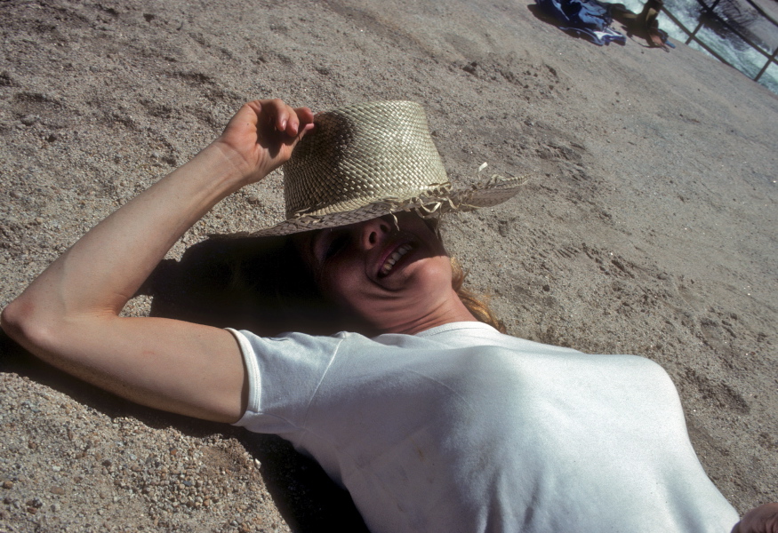 Kay sunbathes next to the Merced River above Nevada Fall.