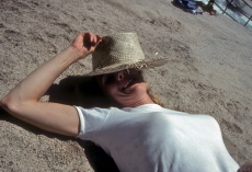 Kay sunbathes next to the Merced River above Nevada Fall.