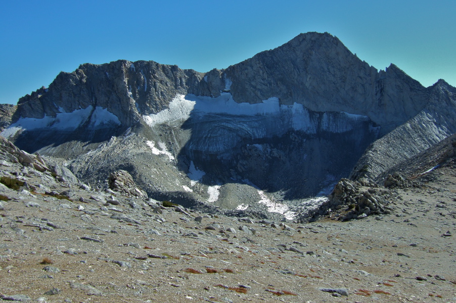 Mt. Conness (12590ft) looms over the low point on North Peak's southeast ridge where the route descends.