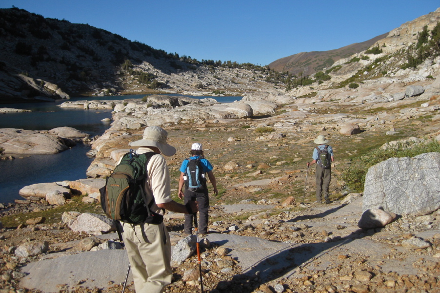 David, Stella, and Bill walk past the lower Conness Lake.