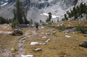 David and Stella walk on the easy section of trail.