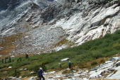 Frank, David, and Stella make their way up the steep trail next to the cascade.