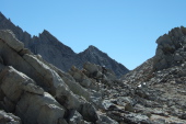 Frank scrambles down from one of the pinnacles near the low point of the ridge