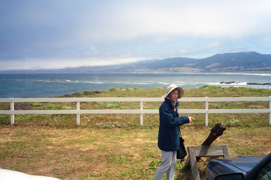 Kay points to an anchor in front of the Pt. Arena Lighthouse.