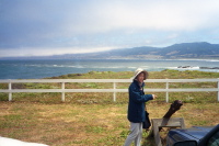 Kay points to an anchor in front of the Pt. Arena Lighthouse.