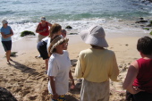 Kay speaks with the turtle monitor at Turtle Beach.