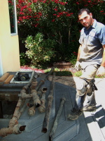Old cast-iron drain pipe removed from house.