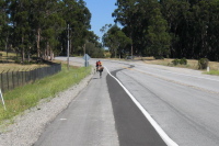 Zach leads Randall and another cyclist on Canada Rd. near Edgewood Rd.