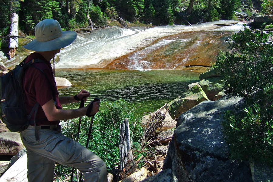 Bill pauses by the granite slide and pool at the top of Illilouette Fall.